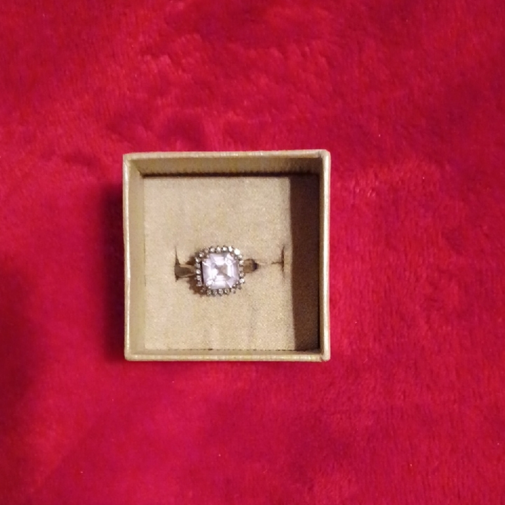 Sterling Silver Ring With A Lavender Stone And Faux Diamonds Around It. Size 7.